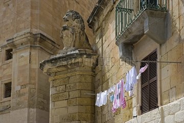 Drying linen ans lion sculpture Valletta Malta