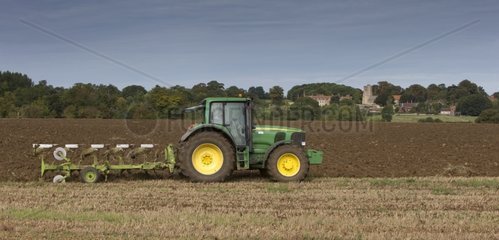 Tractor sowing seeds in a field - GB
