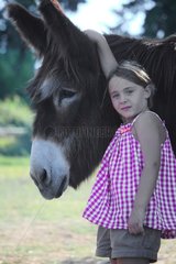 Girl holding a Donkey - France
