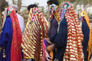 Taru people dancing in traditional costume Terai India