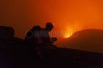 Volcanologist on Piton de la Fournaise in activity  Volcano eruption of May 2015  Reunion