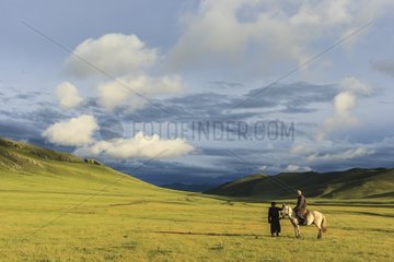 Mongolian horseman in the steppe in the late afternoon - Mongolia