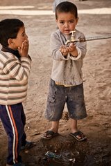 Boys drinking the tap school Khamlia - Morocco