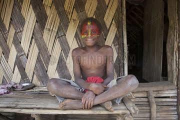 Boy in makeup color of the flag of Vanuatu