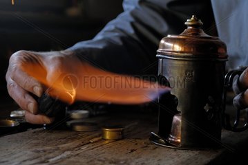 Flame of an old blow lamp in a clock and watch maker France