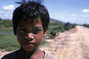 Portrait of a young boy near Siam Reap Cambodia