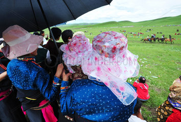 Women watching the races during Lapste - Tibet China