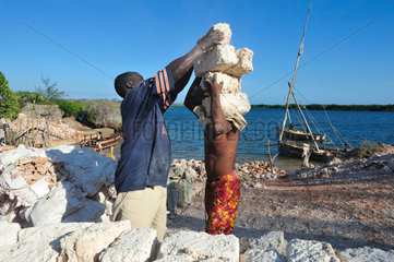 Loading of blocks of coral in a dhow - Lamu Kenya