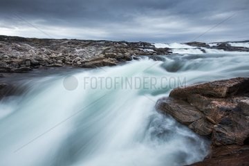 Blurred image of rushing waterfall near Bury Cove along west coast of Hudson Bay (Barren Coastline) 100 miles south of the Arctic Circle  Nunavut Territory  Canada