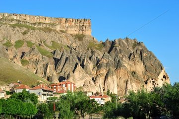 Turkey. Cappadocia. The Ihlara valley. The village of Selime is dominated by a huge cliff full of troglodyte houses.