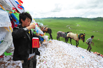 Cavalier praying before the race during Lapste - Tibet China