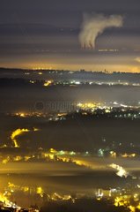 Fog sheet and Bugey nuclear power plant at night France