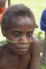 Makeup of a boy in color of the flag of Vanuatu