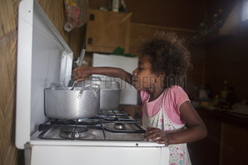 Girl preparing papaya jam - Tanna island Vanuatu