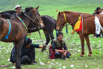 Rider getting ready for a race at the Lapste - Tibet China