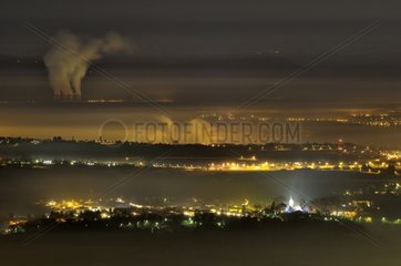Fog sheet and Bugey nuclear power plant at night France