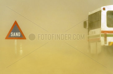 Sand road sign and sandstorm - Namib Desert Namibia