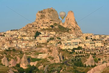 Turkey. Ballooning in Cappadocia. Every morning or so  around one hundred balloons are taking off near Goreme for one hour flight upon the best places of Cappadocia. Here the village of Uchisar.