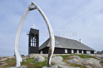 Denmark. Greenland. West coast. Whale's jaws in front of the church of the village of Aasiaat.