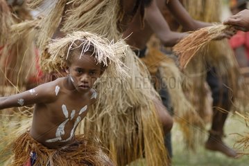 Kanak Child in traditional dress dancing the dugout