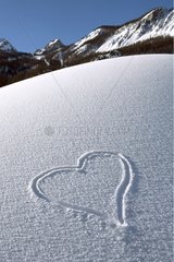 Heart draw in the snow in the Deux Alpes ski resort France