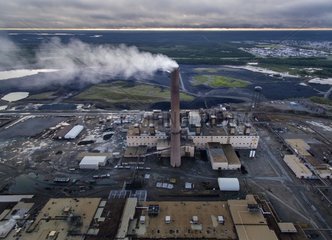 Aerial view of smoke billowing from stack at Vale Inco Manitoba nickel smelter and mine  Thompson  Manitoba  Canada