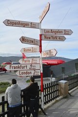 Denmark. Greenland. West coast. AIrport of Kangerlussuaq. Signpost with the distances to the main capitales of the world from the airport of Kangerlussuaq  main airport of the west coast for the local airline company Airgreenland.