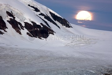 Rise of the moon on the glacier Salmon Canada
