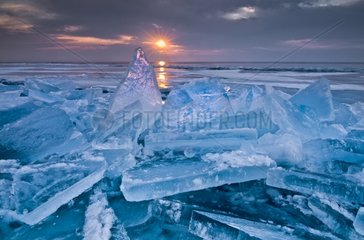 Shards of ice against the rising sun Minnesota USA