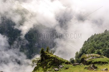 Clouds above the Cirque du Fer à Cheval   Haute Savoie   limestone Circus 4 5 km from development. With walls 500 to 700 meters high  crowned by peaks approaching 3000 meters  it is the largest alpine mountainous cirque . The circus is part of the natural