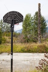 Gitxsan Totem and basketball court in British Columbia