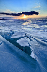 Sunset on the ice of Lake Baikal  Siberia  Russia