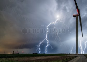 Lightings extracloudy and wind turbines in summer - France