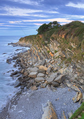 Landscape coastline of the Basque coast between Hendaye and Ciboure at the foot of the corniche  natural site known for its cliffs experiencing erosion problems  sunset  Aquitaine  France