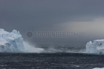 Iceberg in a storm from a glacier Terre Adelie