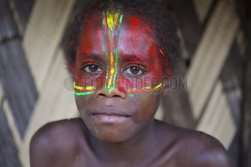 Portrait of boy in makeup color of the flag of Vanuatu