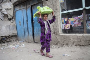 Girl carrying food - Kabul Afghanistan