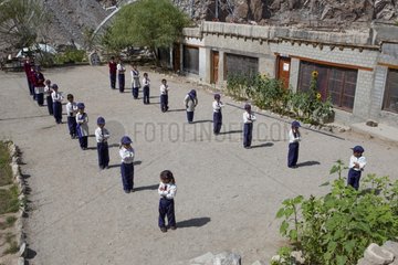 Schoolchildren reciting the national anthem - Himalaya India