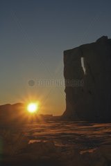 Sun and Astrolabe glacier front in winter Adelie Land