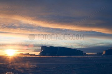 Sunrise on the ice in winter Terre Adelie Land