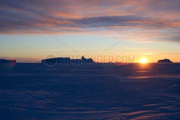 Sunrise on the ice in winter Terre Adelie Land