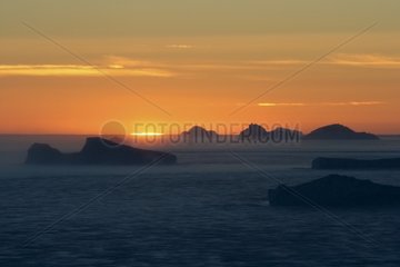 Sunset on Icebergs Adelie Antarctica