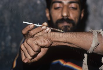 Drug addict injecting heroin Bombay India