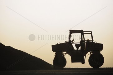 Steamroller silhouette on a building site Morocco
