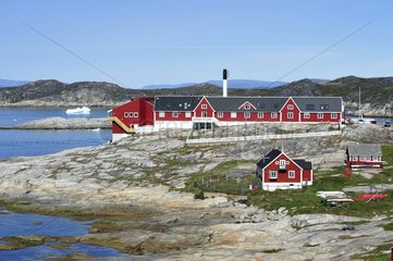 Denmark. Greenland. West coast. Colorfull houses of the village of Ilulissat. Here the power plant.