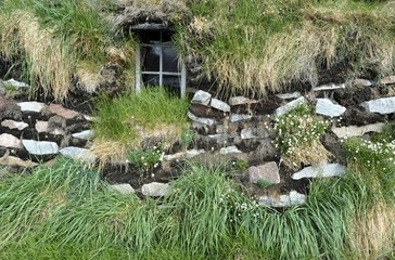 Denmark. Greenland. West coast. Traditionnal house protected by pit in the Inuit museum of the village of Aasiaat.