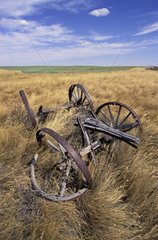 Farm machinery abandoned in a field Saskatchewan Canada
