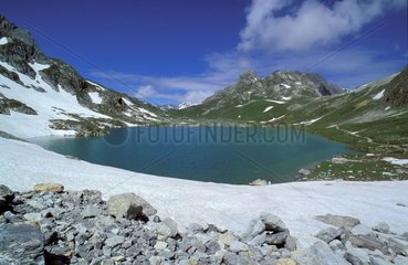 Round lake in the massif of Rochilles in July France