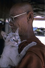 Monk carrying a cat Burma
