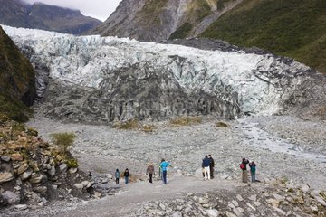 Tourists at lookout of Fox Glacier Southern Alps New Zealand